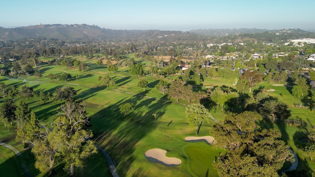 Panoramic view of a lush green golf course at Santa Barbara Golf Club. Smooth