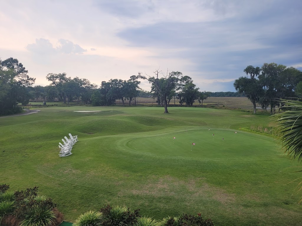 Panoramic view of a lush green golf course at Sapelo Hammock Golf Club. Smooth