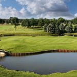 Panoramic view of a lush green golf course at Saskatoon Golf Club. Smooth