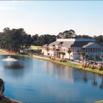 Panoramic view of a lush green golf course at Savannah Country Club. Smooth