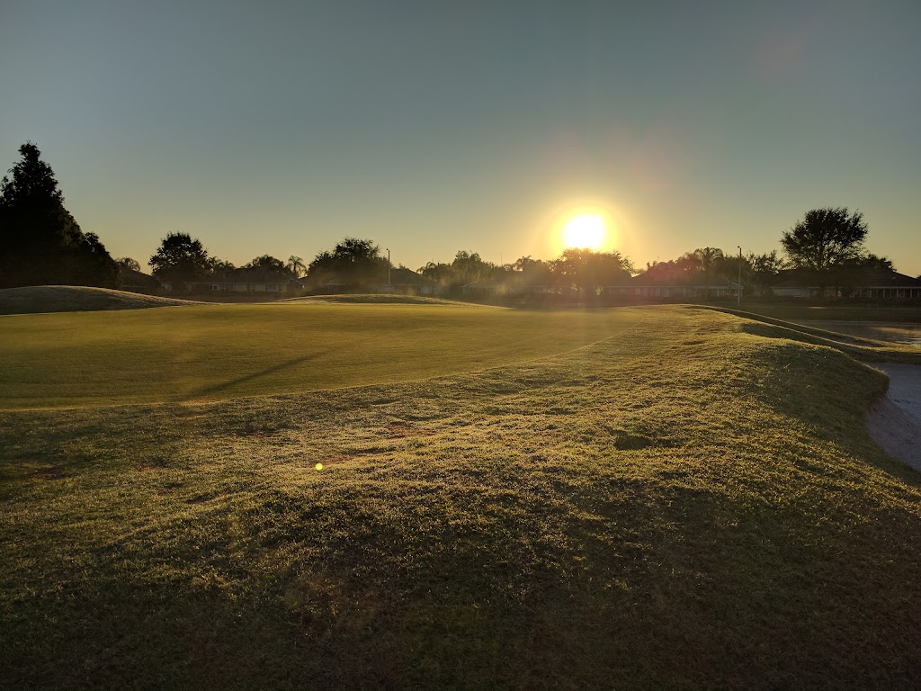 Panoramic view of a lush green golf course at Scepter Golf Club. Smooth