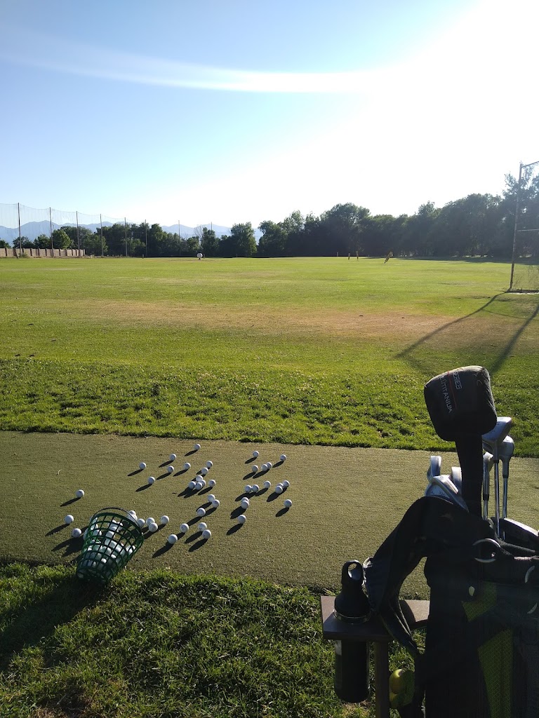 Panoramic view of a lush green golf course at Schneiter's Pebblebrook Golf Club. Smooth