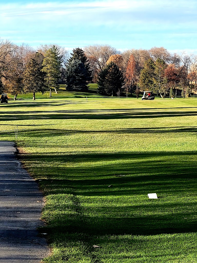 Panoramic view of a lush green golf course at Schneiter's Riverside Golf. Smooth