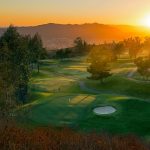 Panoramic view of a lush green golf course at Scholl Canyon Golf Course. Smooth