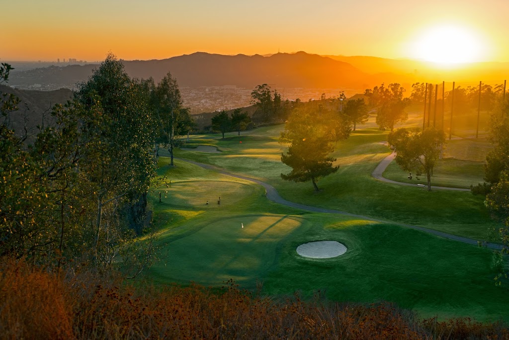 Panoramic view of a lush green golf course at Scholl Canyon Golf Course. Smooth