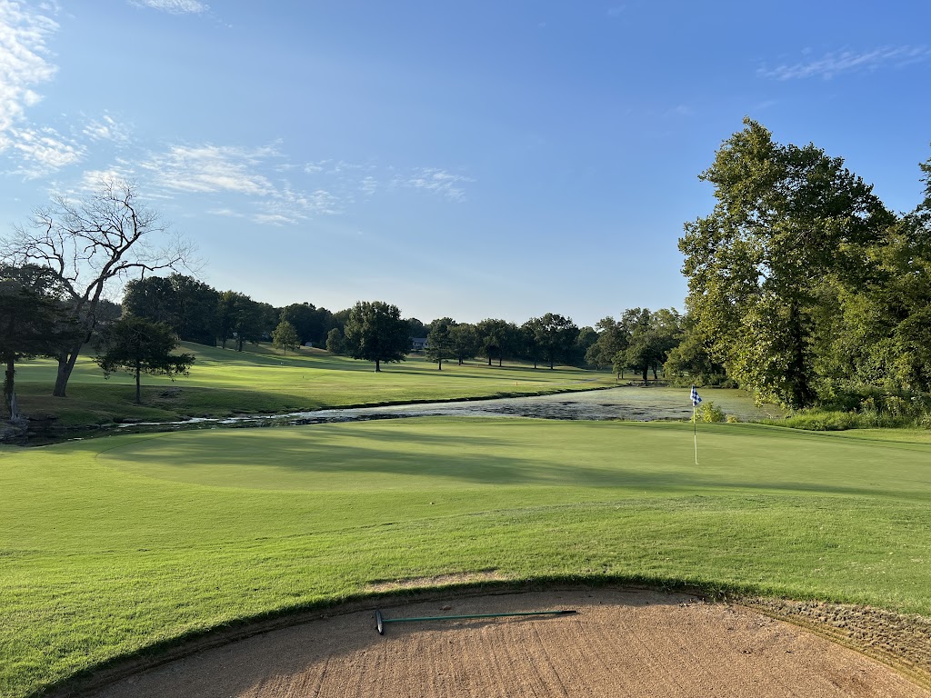 Panoramic view of a lush green golf course at Scotsdale Golf Course. Smooth