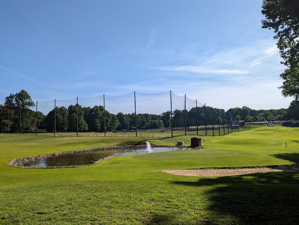 Panoramic view of a lush green golf course at Severna Park Golf Center. Smooth