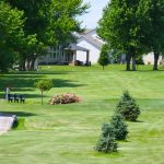 Panoramic view of a lush green golf course at Seward Community Golf Course. Smooth