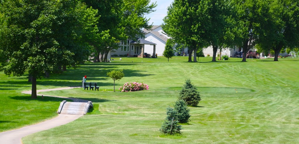 Panoramic view of a lush green golf course at Seward Community Golf Course. Smooth