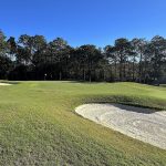 Panoramic view of a lush green golf course at Shell Landing Golf Club. Smooth