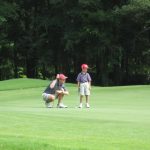 green grass with the flag in the hole.