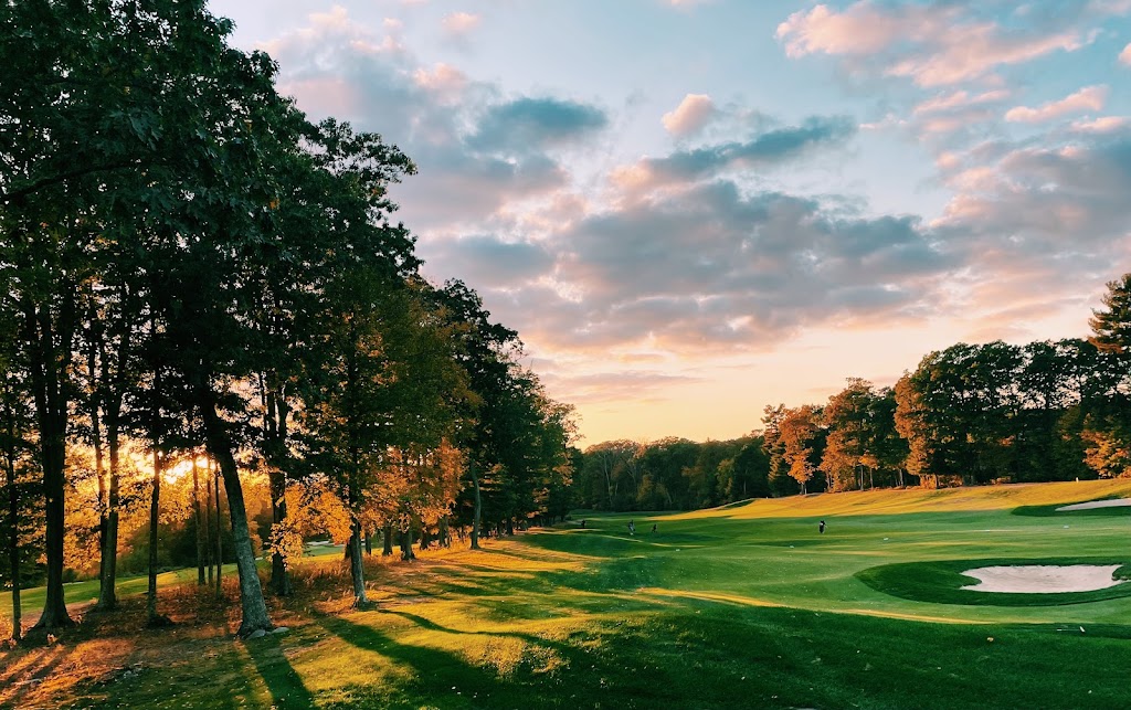 Panoramic view of a lush green golf course at Shining Rock Golf Club. Smooth