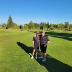 Panoramic view of a lush green golf course at Sidney Country Club. Smooth