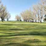 Panoramic view of a lush green golf course at Signal Point Golf Club. Smooth