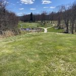 Panoramic view of a lush green golf course at Skungamaug River Golf Club. Smooth