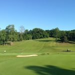 Panoramic view of a lush green golf course at Smithtown Landing Golf Course LLC. Smooth