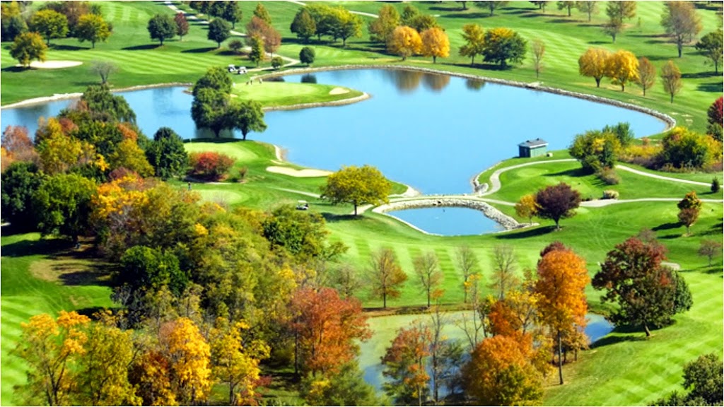 Panoramic view of a lush green golf course at Snow Hill Golf Course. Smooth