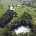 Panoramic view of a lush green golf course at Soldiers Creek Golf Course. Smooth