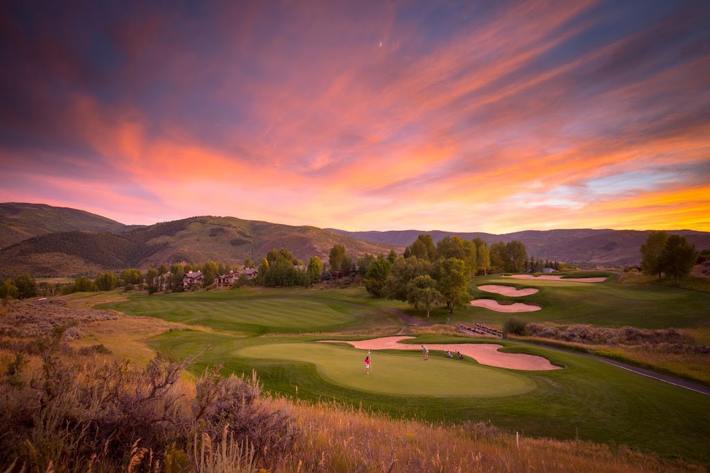 Panoramic view of a lush green golf course at Sonnenalp Club. Smooth