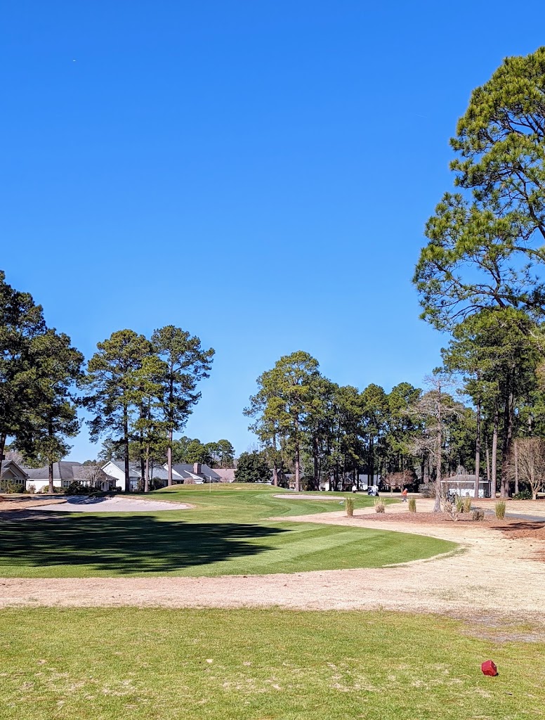 Panoramic view of a lush green golf course at South Creek at Myrtle Beach National. Smooth