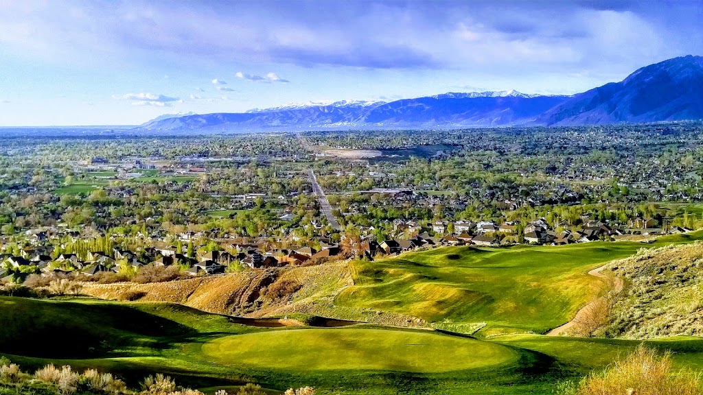 Panoramic view of a lush green golf course at South Mountain Golf Course. Smooth