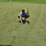 Panoramic view of a lush green golf course at Southern Oaks Championship Golf Course. Smooth