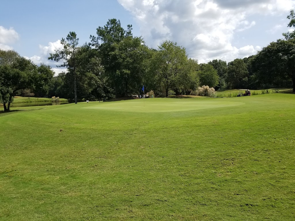 Panoramic view of a lush green golf course at Southern Oaks Golf Course. Smooth