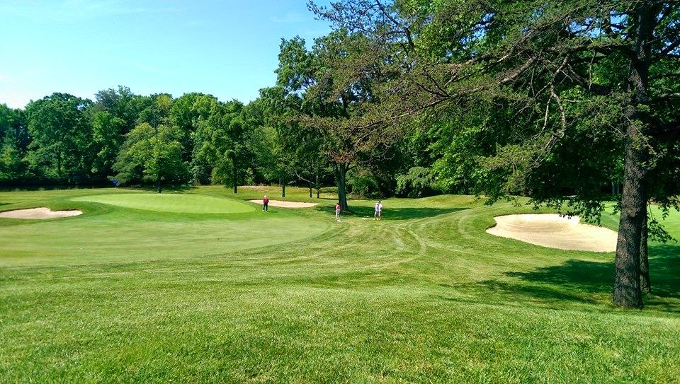 Panoramic view of a lush green golf course at Sparrows Point Country Club. Smooth