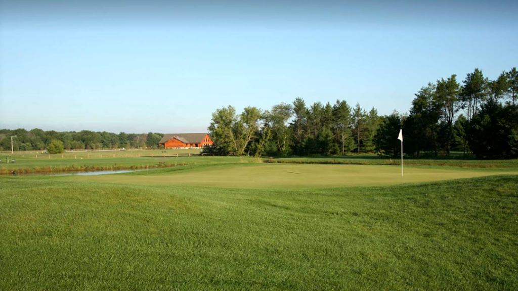 Panoramic view of a lush green golf course at Spring Brook Golf Course. Smooth