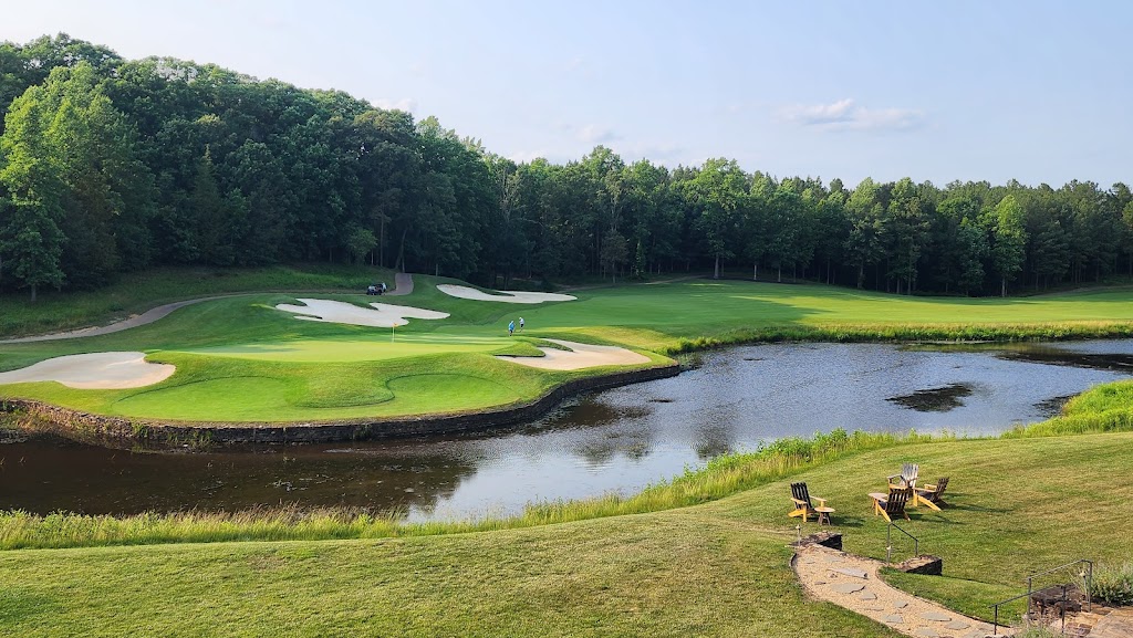 Panoramic view of a lush green golf course at Spring Creek Golf Club. Smooth