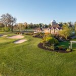 Panoramic view of a lush green golf course at Spring Hollow Golf Club. Smooth