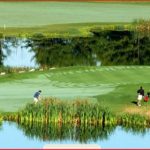 Panoramic view of a lush green golf course at Spring Meadows Golf Club. Smooth