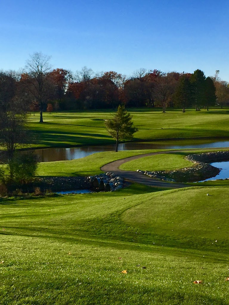 Panoramic view of a lush green golf course at Springdale Golf Course. Smooth