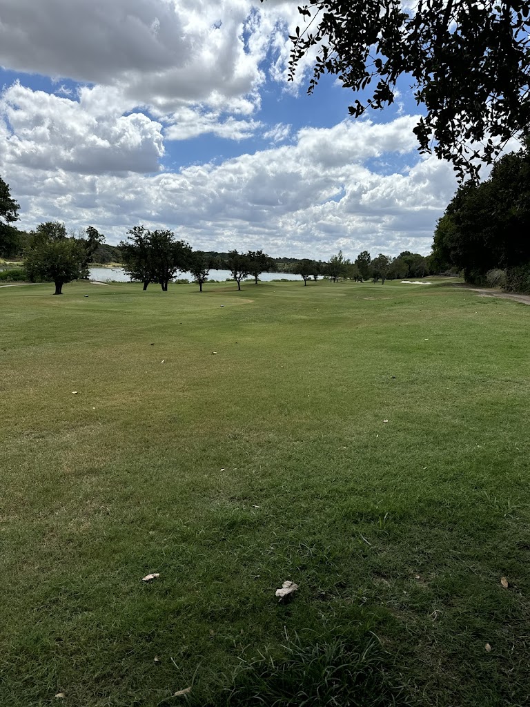 Panoramic view of a lush green golf course at Squaw Creek Golf Course. Smooth