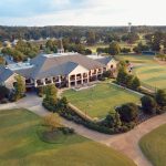 Panoramic view of a lush green golf course at Squire Creek Country Club. Smooth