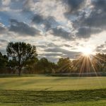 Panoramic view of a lush green golf course at St Andrews Golf Club. Smooth