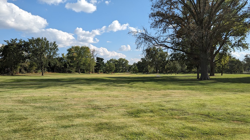 Panoramic view of a lush green golf course at St. Ann Golf Course. Smooth