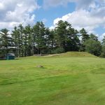 Panoramic view of a lush green golf course at St Croix Country Club. Smooth