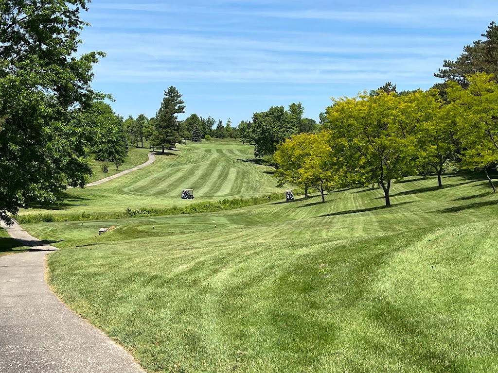 Panoramic view of a lush green golf course at St. Denis Golf Course & Party Center. Smooth