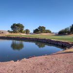 Panoramic view of a lush green golf course at Stallion Mountain Golf Club. Smooth