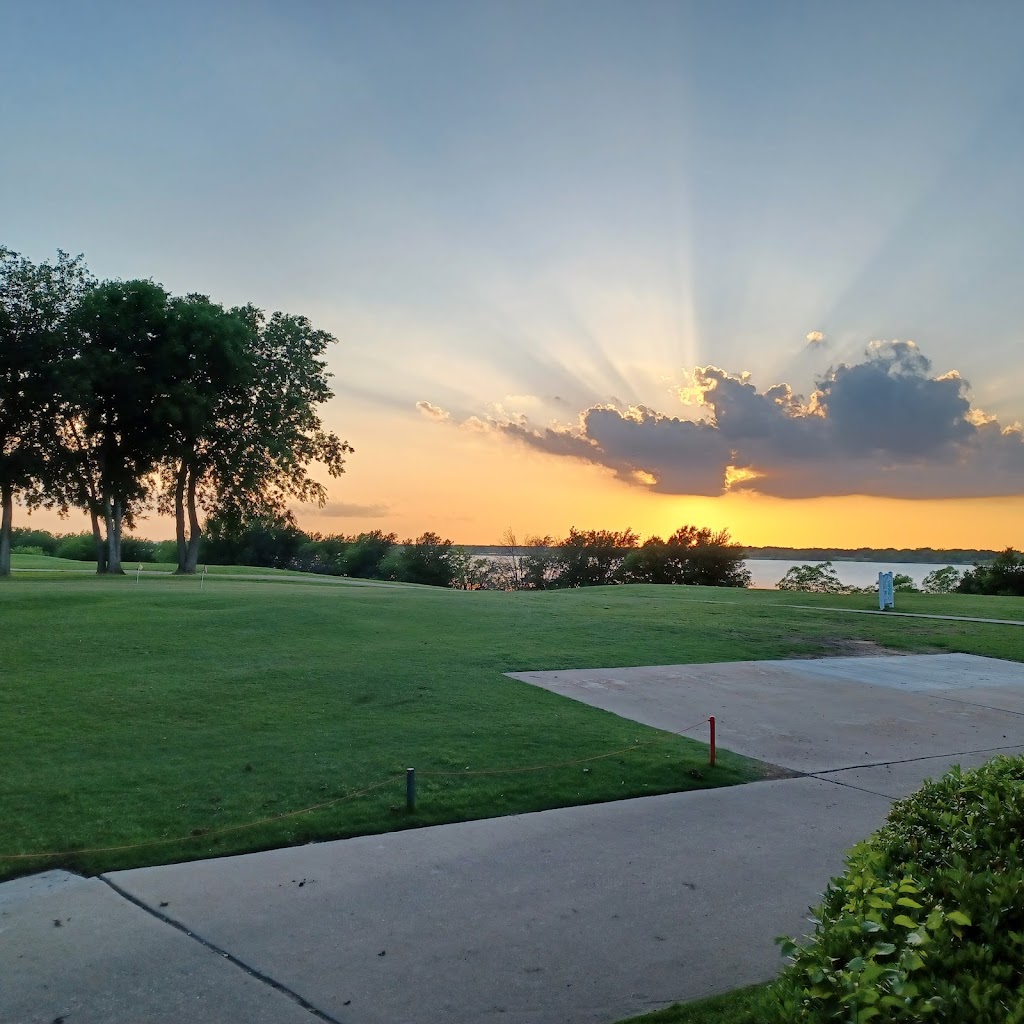 Panoramic view of a lush green golf course at Stewart Peninsula Golf Course. Smooth