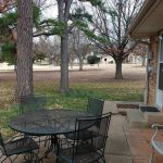 Panoramic view of a lush green golf course at Stillwater Country Club. Smooth