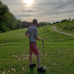 green grass with the flag in the hole.