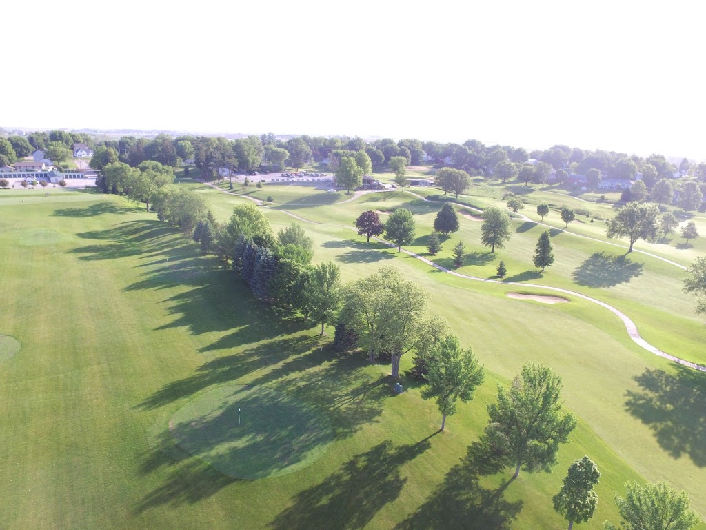 Panoramic view of a lush green golf course at Stone Creek Golf Club. Smooth