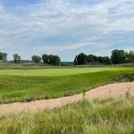 Panoramic view of a lush green golf course at StoneRidge Golf Club. Smooth