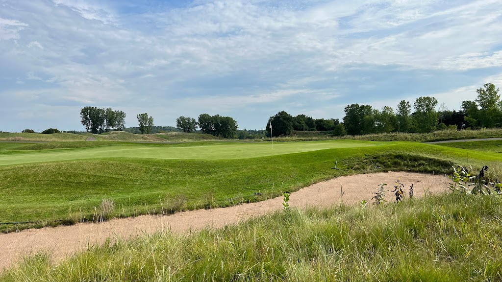 Panoramic view of a lush green golf course at StoneRidge Golf Club. Smooth