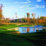 Panoramic view of a lush green golf course at StoneWater Golf Club & Venue. Smooth