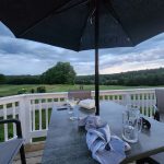 Panoramic view of a lush green golf course at Stonebridge Country Club. Smooth