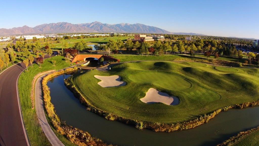 Panoramic view of a lush green golf course at Stonebridge Golf Club. Smooth