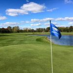 Panoramic view of a lush green golf course at Stonebridge Golf Club. Smooth